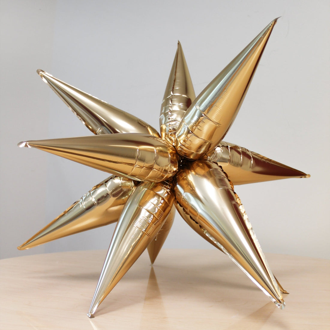 Gold 12-point starburst foil balloon for birthday and bachelorette party balloon arch decor